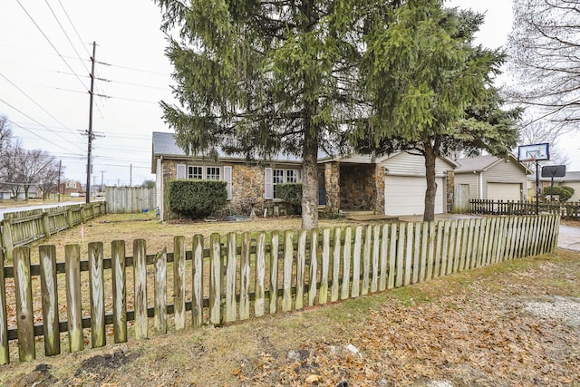 view of front of home featuring a garage and a front lawn