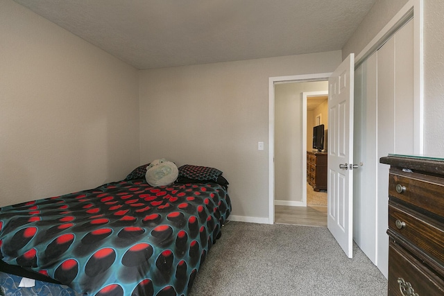 carpeted bedroom with a closet