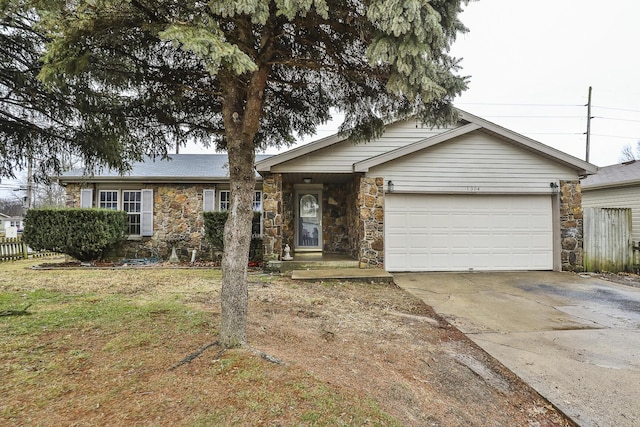 ranch-style home with a garage and a front yard