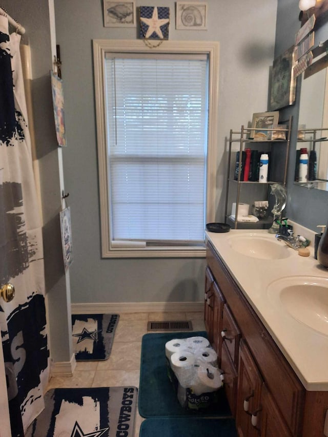 bathroom featuring tile patterned floors and vanity