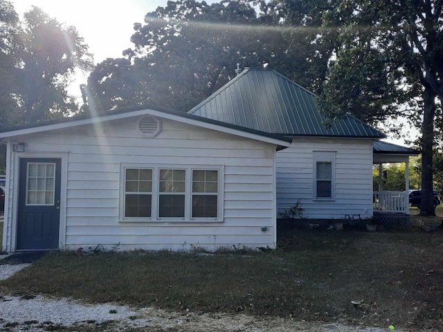 view of home's exterior featuring a lawn