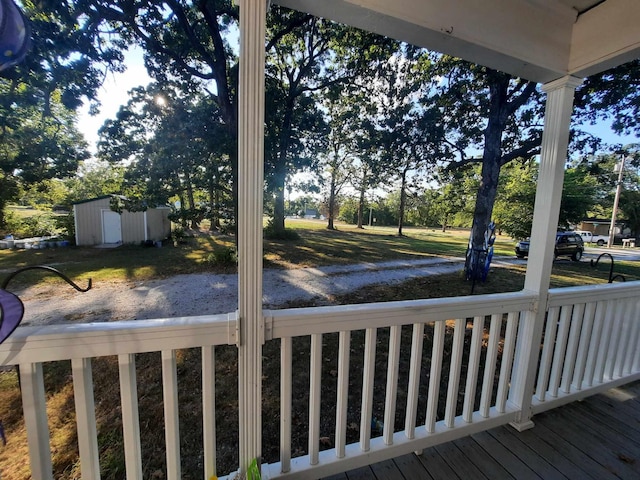 deck with a storage shed