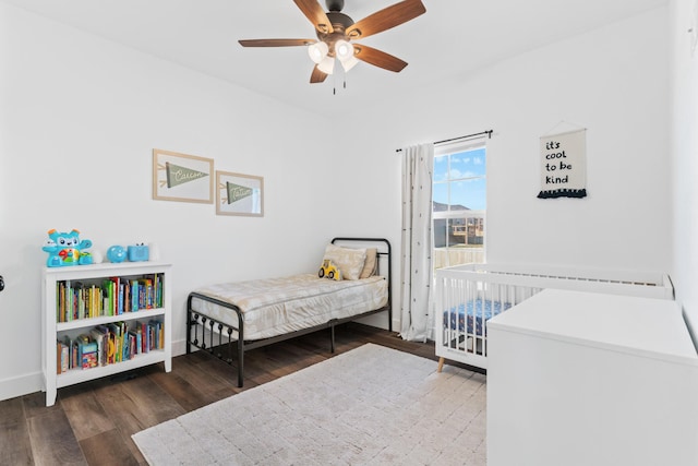 bedroom with dark wood-type flooring and ceiling fan