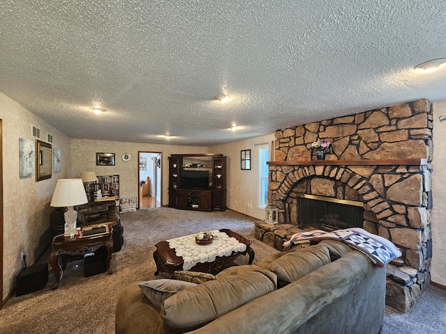 living room with a stone fireplace, carpet flooring, and a textured ceiling