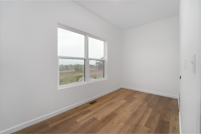 unfurnished room featuring hardwood / wood-style floors