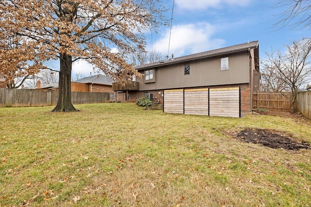 rear view of property with a lawn