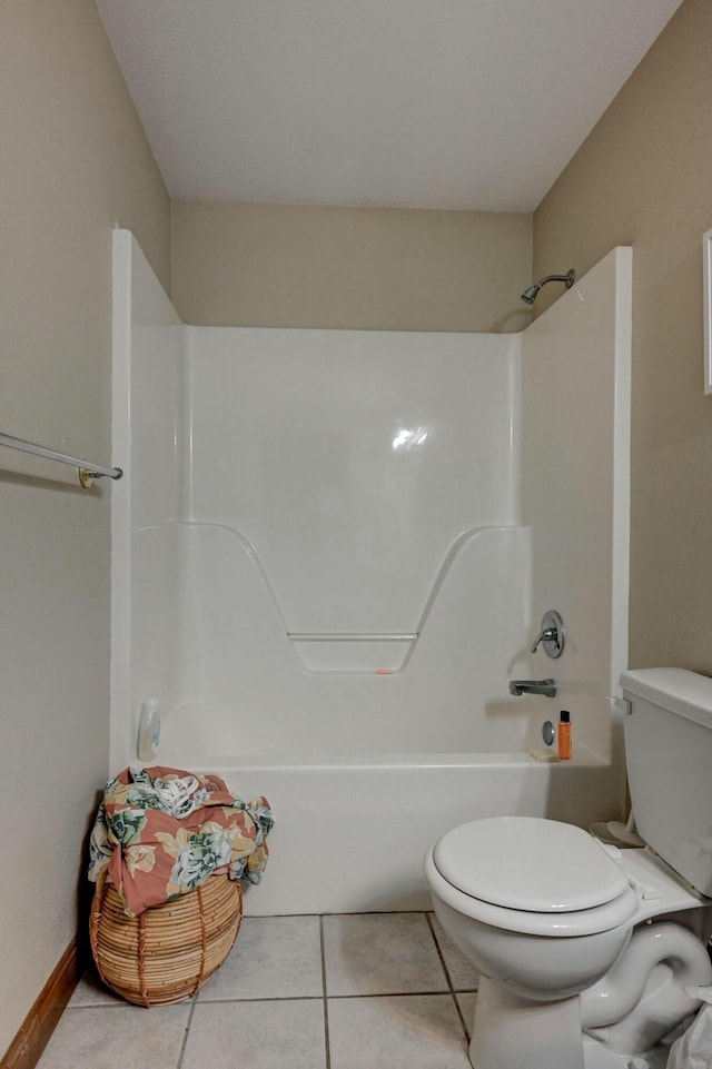 bathroom with shower / bath combination, tile patterned floors, and toilet