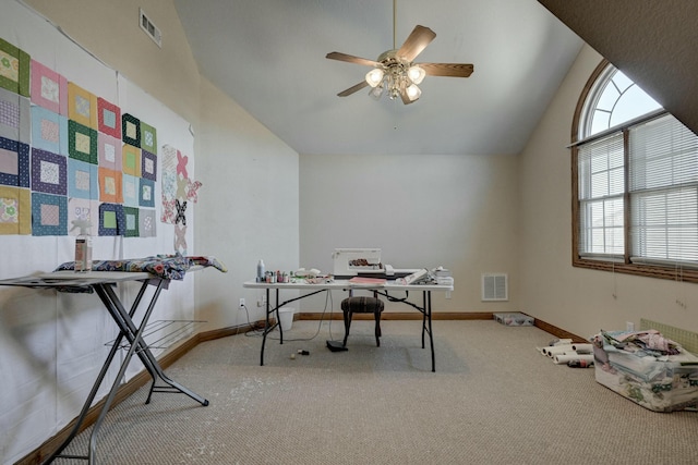 office area featuring lofted ceiling, carpet flooring, and ceiling fan