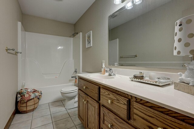 full bathroom featuring bathtub / shower combination, vanity, toilet, and tile patterned flooring