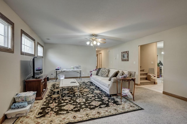 living room with ceiling fan and light colored carpet