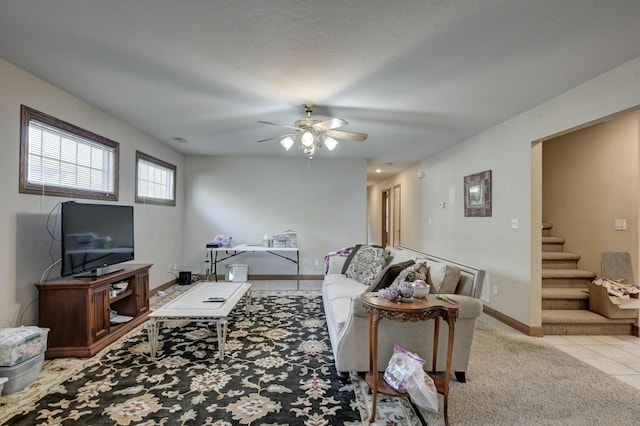 carpeted living room featuring ceiling fan