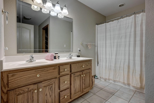 bathroom with vanity and tile patterned floors