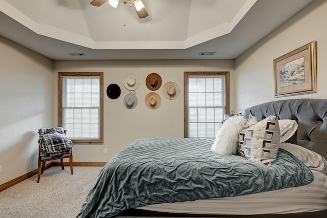 bedroom with ceiling fan, lofted ceiling, carpet floors, and multiple windows