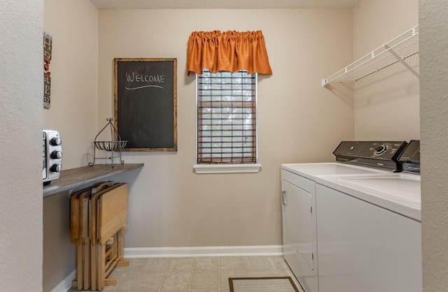 laundry room with separate washer and dryer