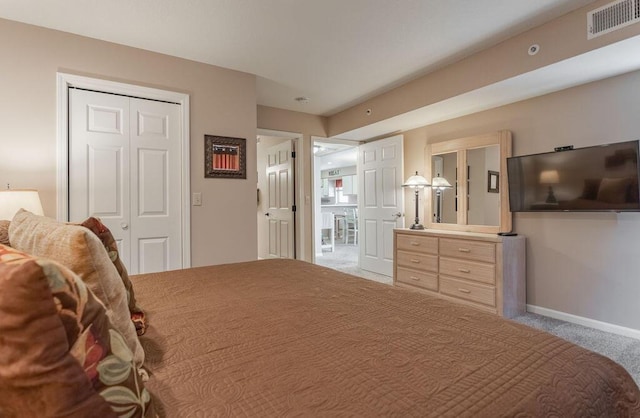 bedroom with carpet floors and a closet