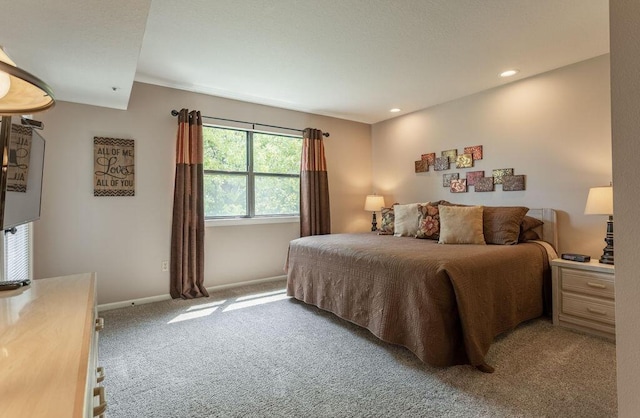 bedroom with light colored carpet