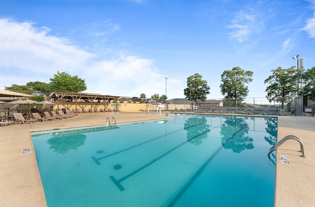 view of swimming pool with a patio