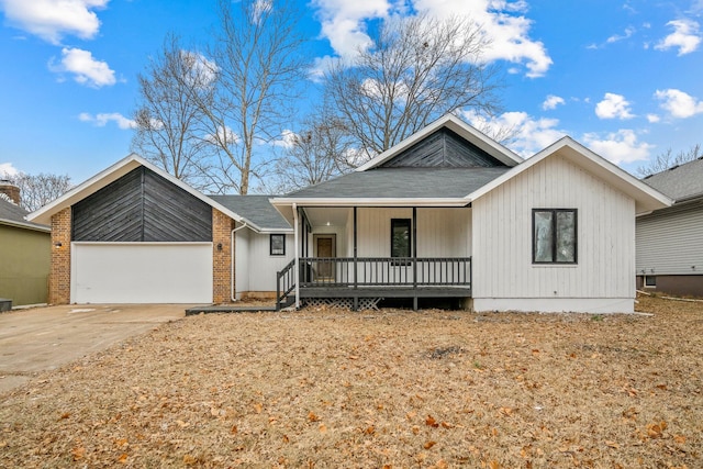 view of front of home with a porch and a garage