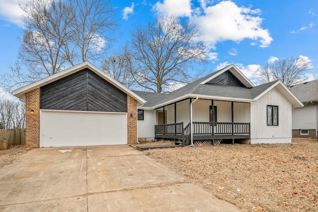 view of front of home with a porch and a garage