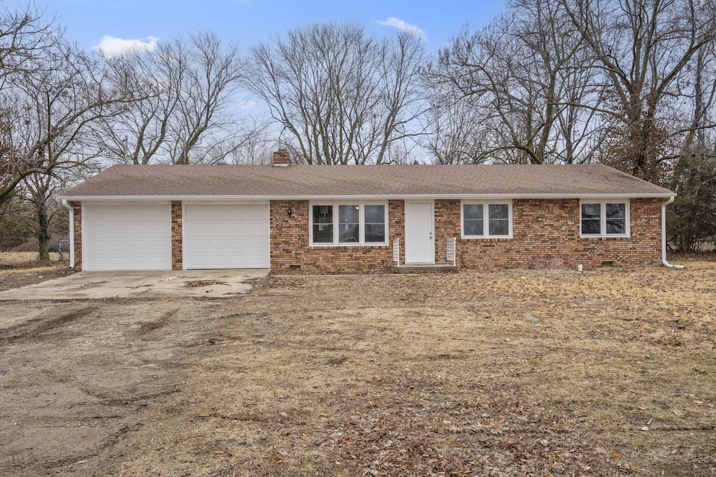 ranch-style house featuring a garage