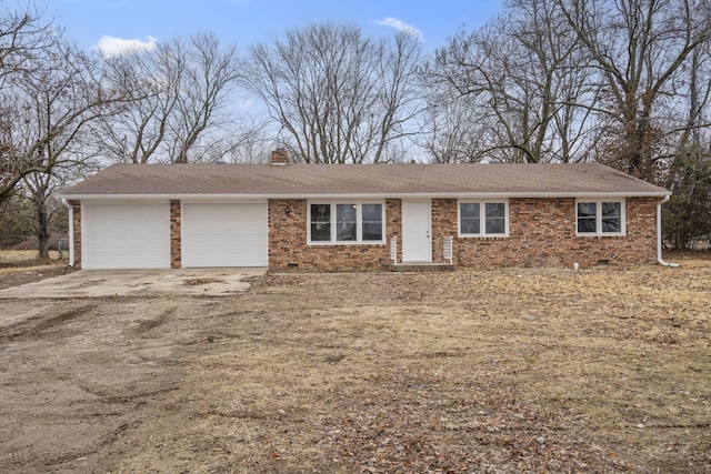 ranch-style house featuring a garage