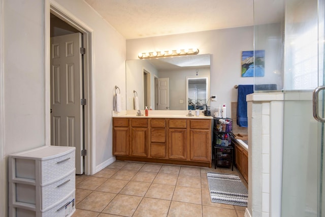 bathroom with tile patterned floors, shower with separate bathtub, and vanity