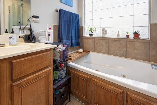 bathroom featuring independent shower and bath and vanity