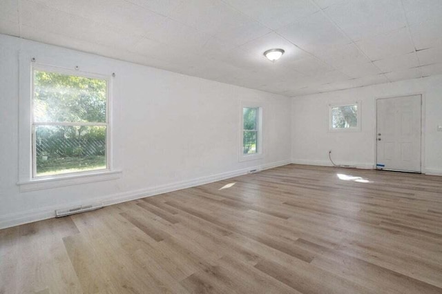 spare room featuring light hardwood / wood-style flooring