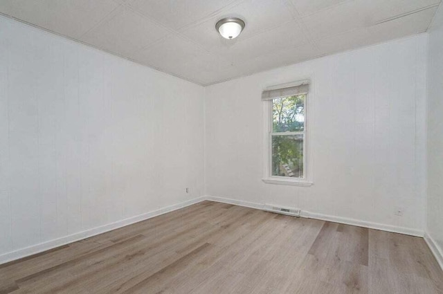 spare room with light wood-type flooring