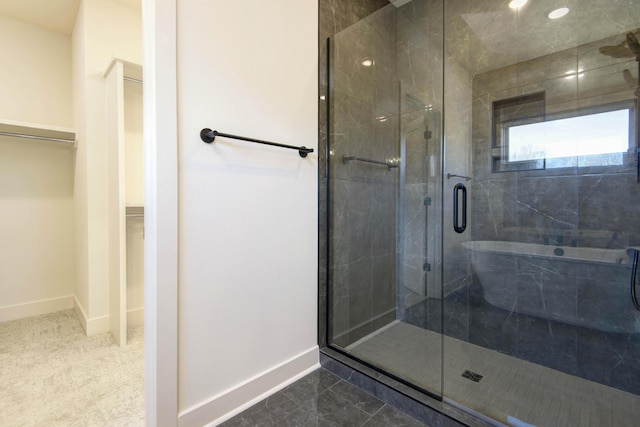 bathroom with tile patterned floors and a shower with shower door