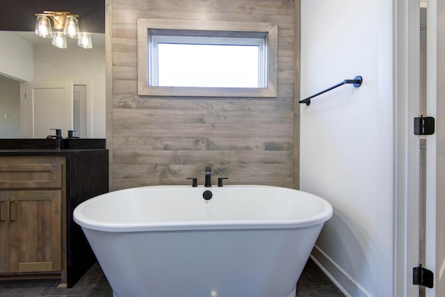 bathroom with a bathing tub and vanity