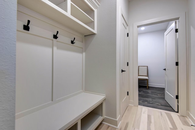 mudroom with light hardwood / wood-style floors