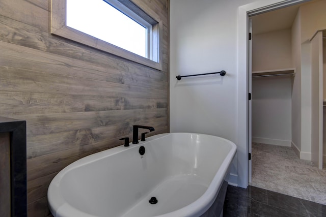 bathroom with a tub to relax in