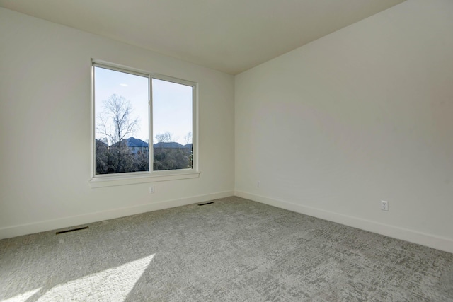 unfurnished room featuring carpet floors