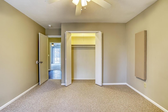 unfurnished bedroom featuring light carpet, a closet, and ceiling fan