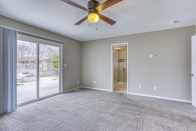 spare room featuring ceiling fan and light colored carpet