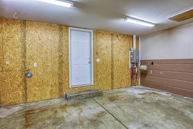 interior space with water heater and concrete floors