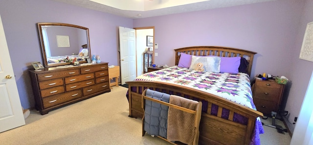 bedroom featuring light colored carpet