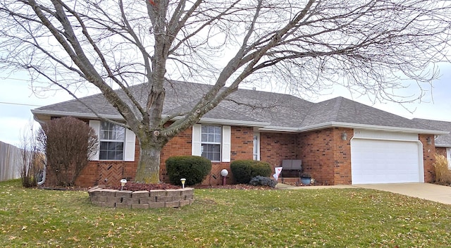 ranch-style home with a garage and a front lawn