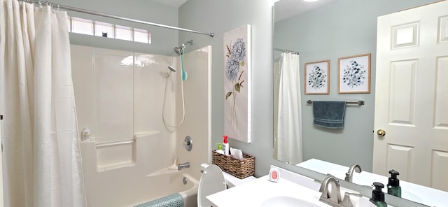 full bathroom featuring vanity, shower / tub combo, and toilet