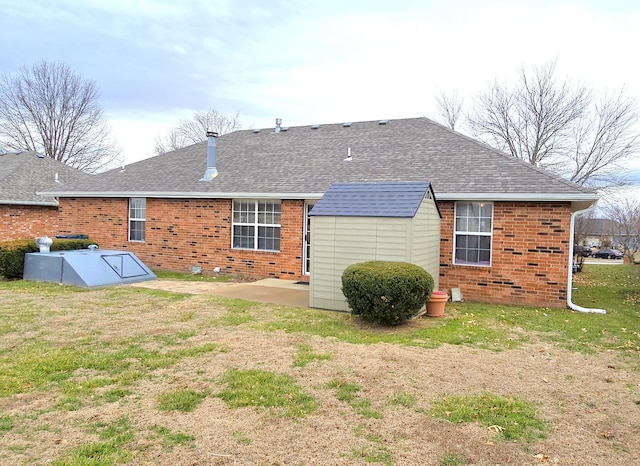 back of property with a patio and a lawn