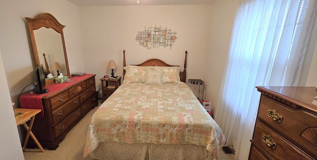 bedroom with light colored carpet