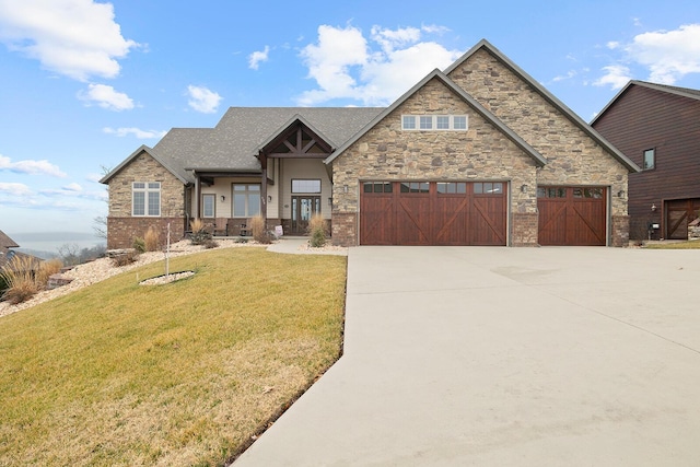 craftsman-style house featuring a garage and a front lawn