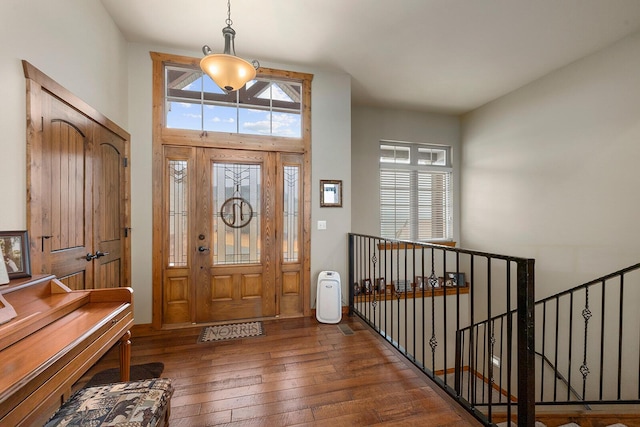 entrance foyer with dark hardwood / wood-style floors