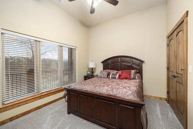 bedroom featuring light carpet and ceiling fan