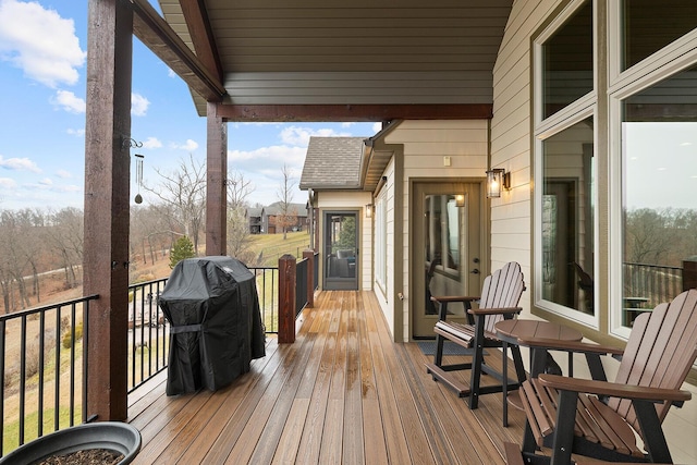 wooden deck with grilling area