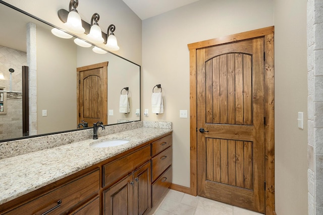 bathroom featuring vanity, tile patterned flooring, and a shower with door