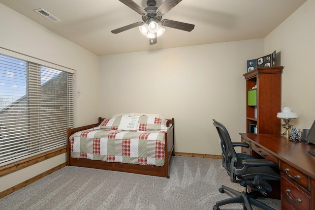 bedroom with light colored carpet and ceiling fan