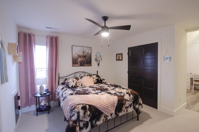 carpeted bedroom featuring ceiling fan