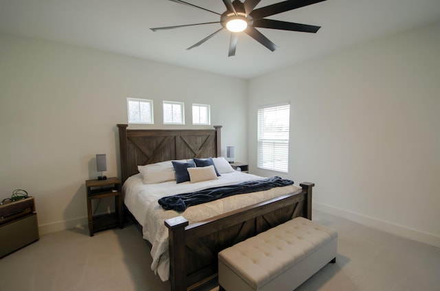 bedroom with light carpet and ceiling fan